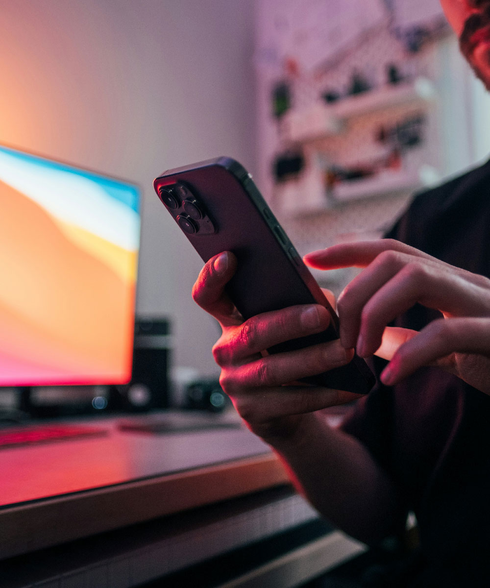 A person using a gadget at home