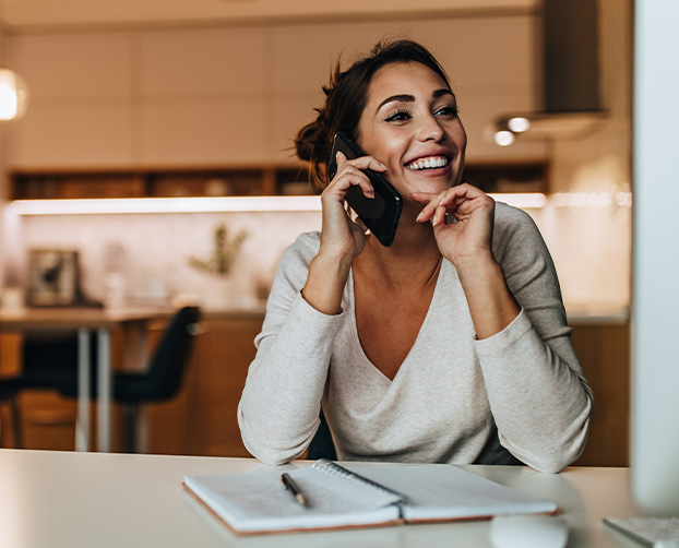 a happy lady on the phone